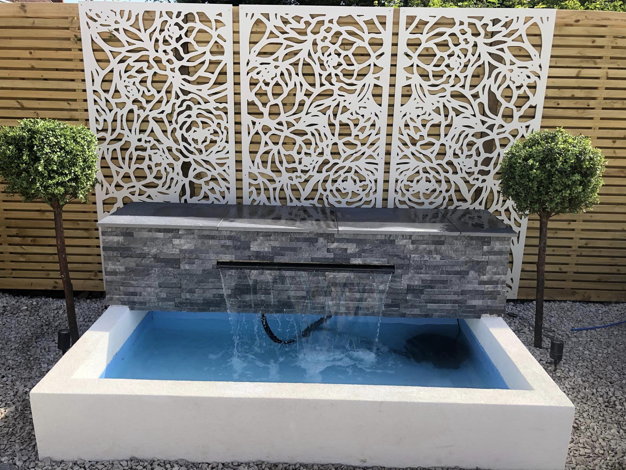 Water feature with stone cladding and decorative screen panels, Evington Leicester