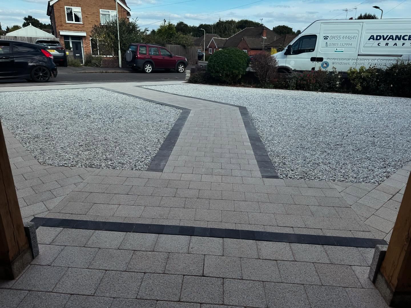 View from entrance showing block paving path and charcoal edging detail — Kirby Muxloe