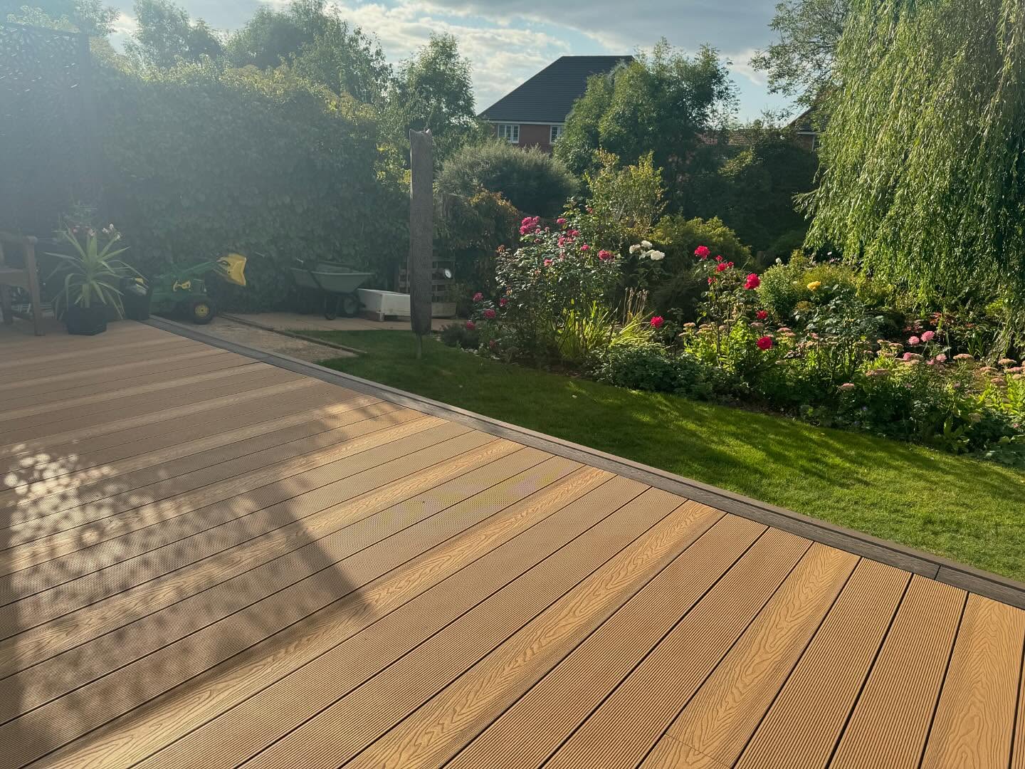 Composite deck edge meeting lawn — detail view, Kirby Muxloe