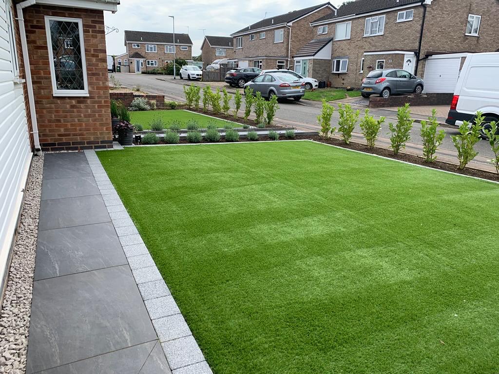 Front garden renovation Wigston — artificial grass, porcelain path and ornamental planting
