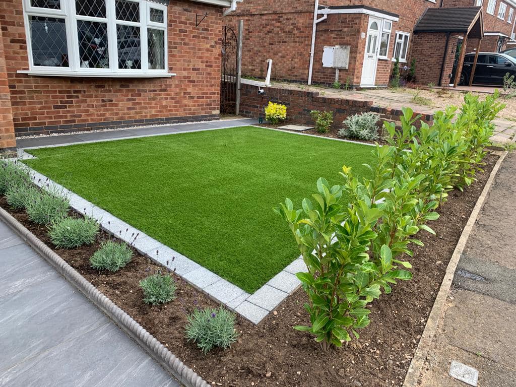 Front garden with lavender border, young bay trees and artificial grass, Wigston