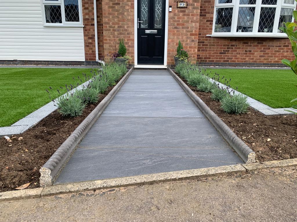 Porcelain slate pathway to front door flanked by lavender planting and artificial grass, Wigston